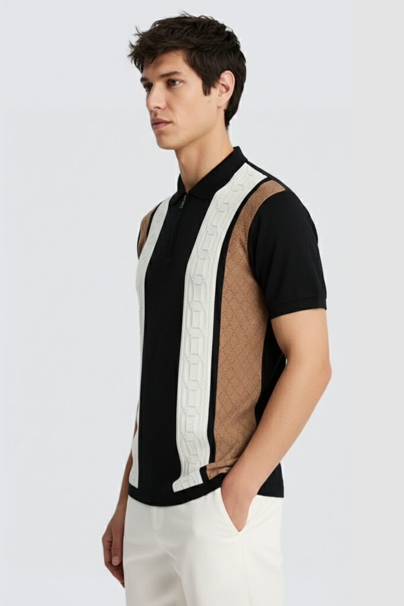 Man wearing a black and white patterned shirt with a plain background