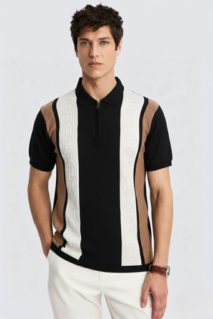 Man wearing a black and white striped shirt with a plain background