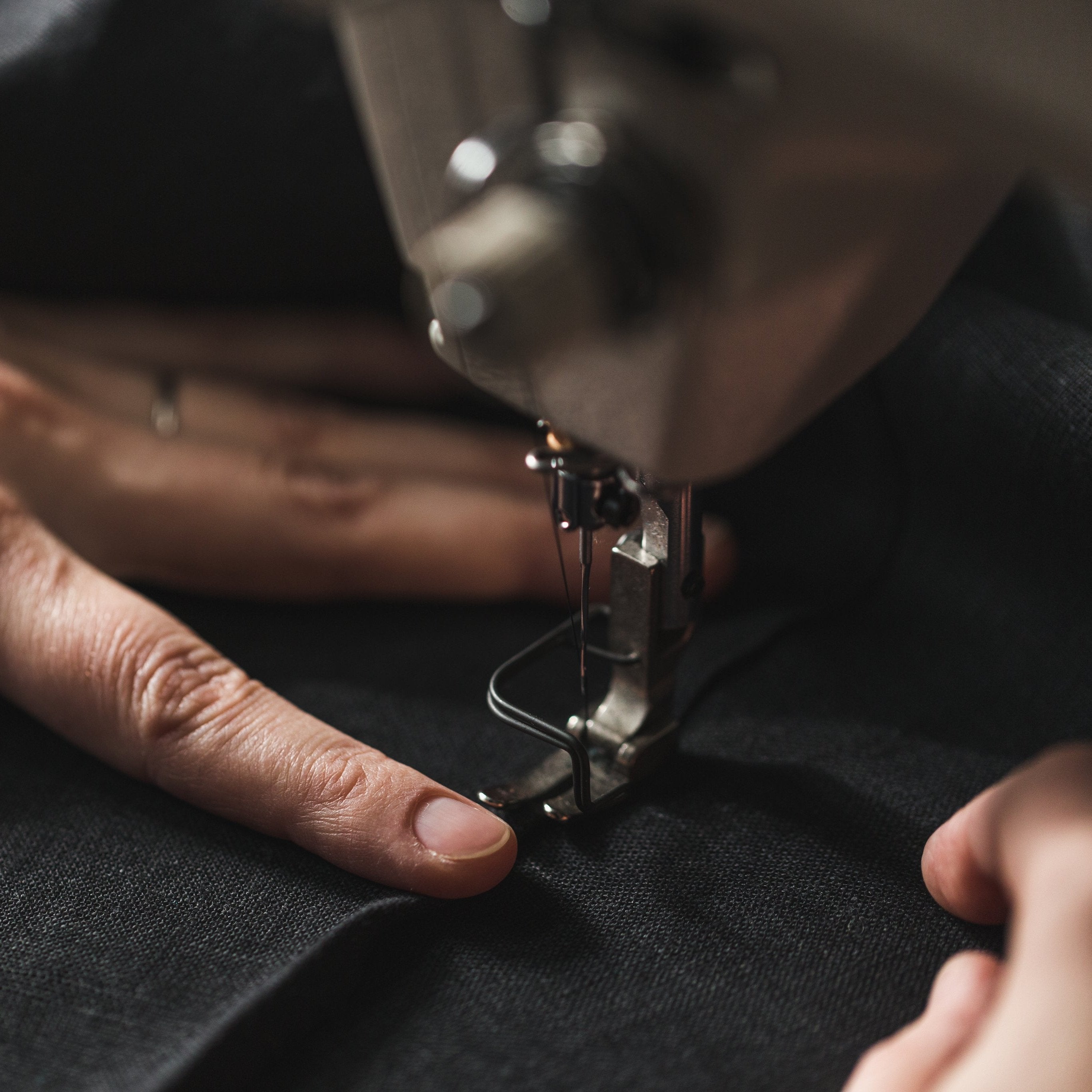 black fabric in sewing machine