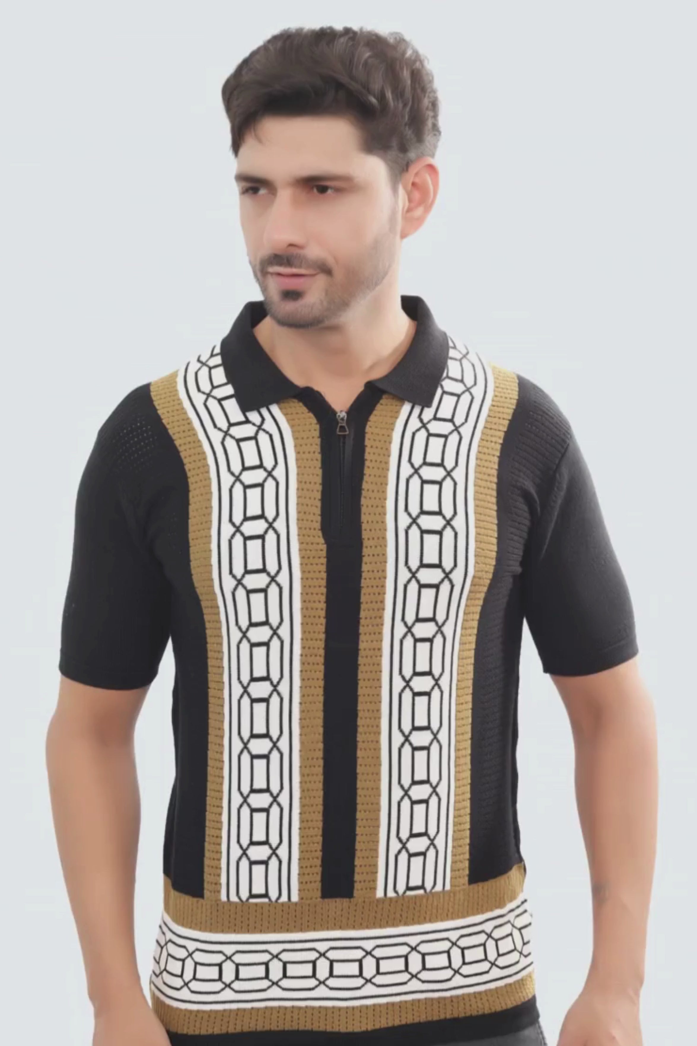 Man wearing a black short-sleeve shirt with a geometric pattern on a white background